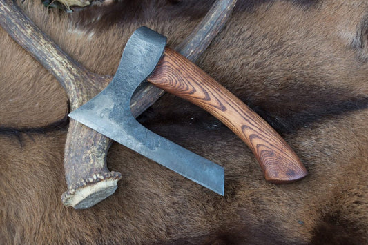 Forged fist axe with a case